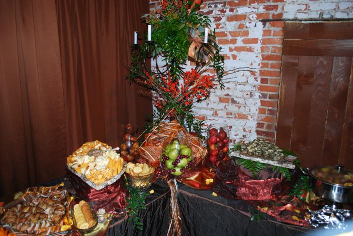 Monterey Chicken, Cheese Display, Stuffed Mushrooms, and Potato Wedges with Sides.